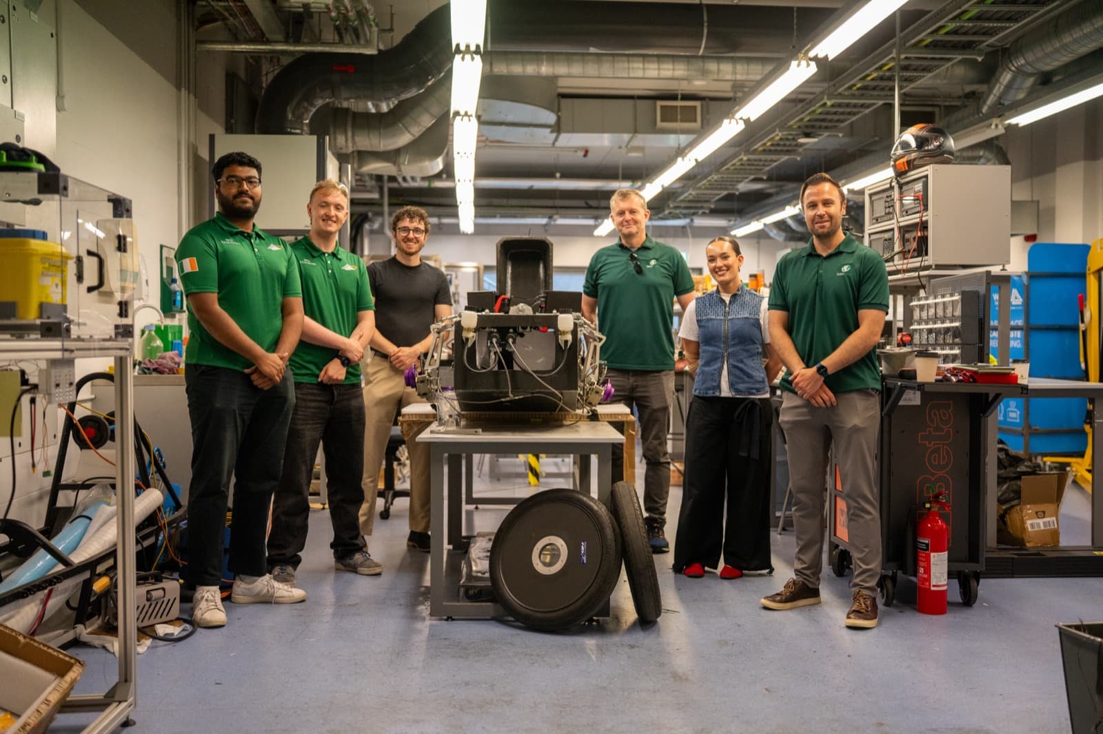 The VisionGreen team with the DCU Solar Racing students and their car.
