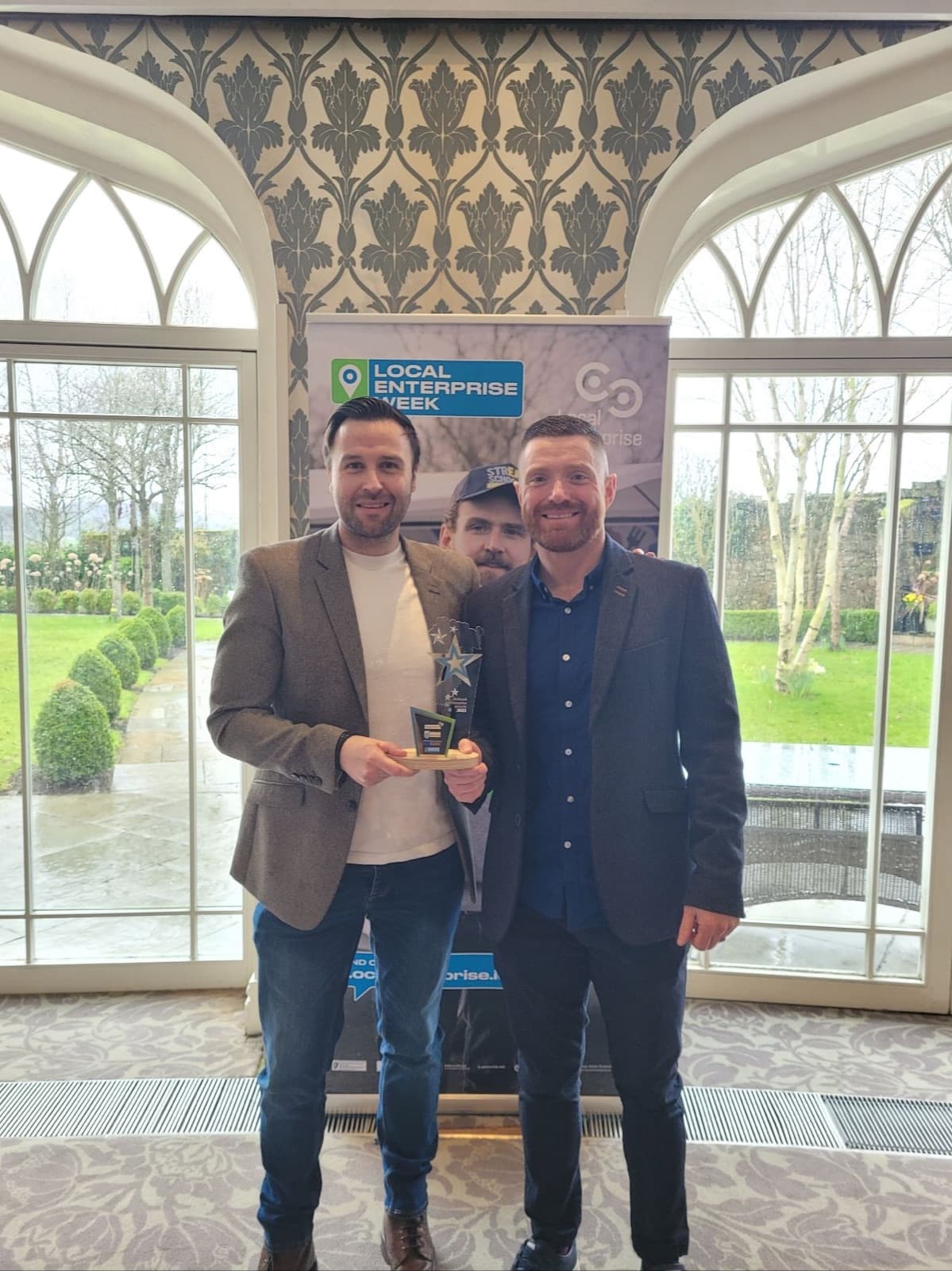 John Pakenham and Ronan Murphy with an innovation award.