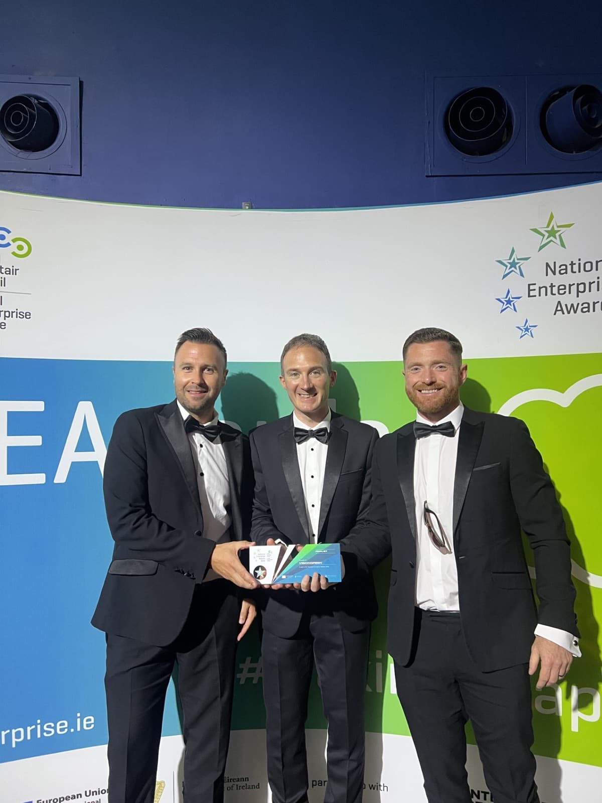 The VisionGreen team holding the Green Business of the Year trophy at the National Enterprise Awards 2025.