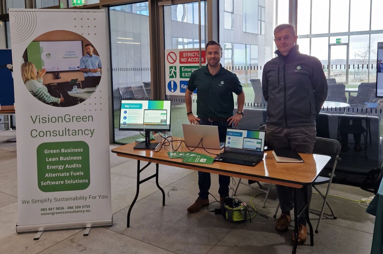 Ronan Murphy and Jack Fahey at the VisionGreen stand at an industry event.