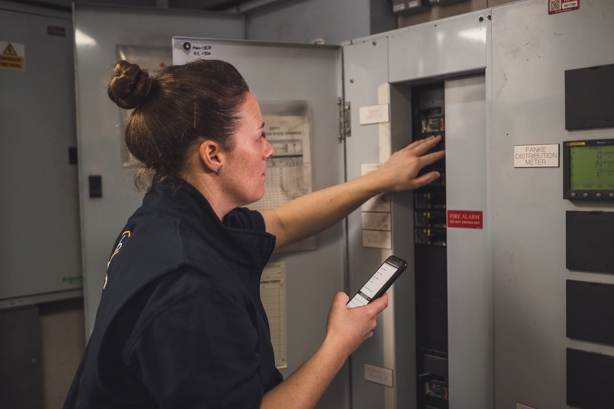 An engineer checking a distribution board.